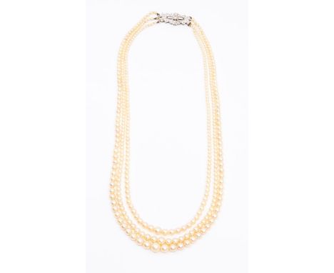 An Art Deco three row pearl and diamond necklace, comprising three graduated rows of pearls the smallest approx. 2.2mm to the