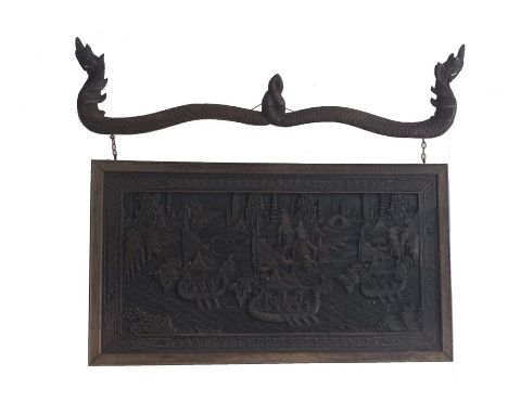A South East Asian or Chinese carved hardwood panel, Qing Dynasty, late 19th/early 20th Century, of rectangular form and land