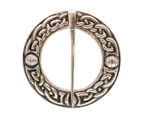 Alexander Ritchie- A Scottish silver kilt/plaid brooches, circular form with embossed Celtic decoration, diameter approx. 50m