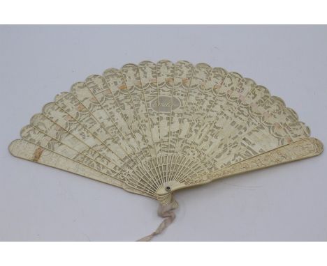 A Chinese Canton ivory brise fan, first half 19th Century, the guards carved with figures and dragons, the sticks forming a s