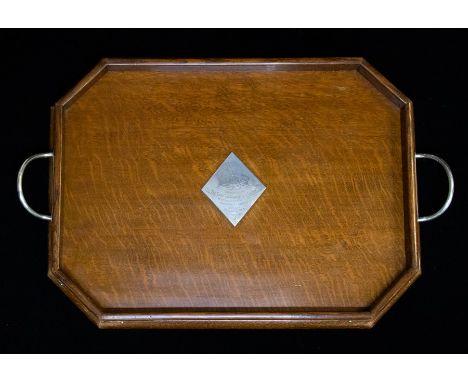 An Edwardian silver mounted oak presentation Butler's two handled tray, with central diamond shaped silver cartouche engraved