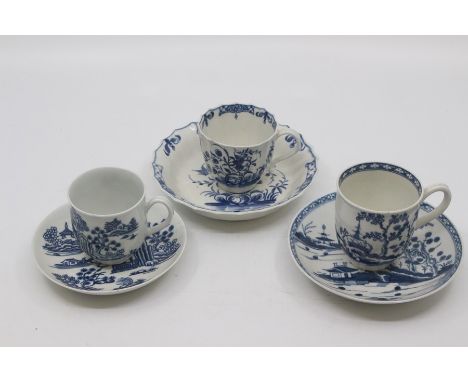 Three Worcester coffee cups and saucers, 1770-1790, the first of fluted form and painted in blue with the 'Hollow Rock Lily' 