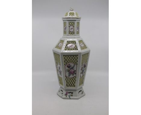 A Chinese famille rose double-walled reticulated porcelain vase and cover, late Qing Dynasty, 19th Century, of hexagonal sect