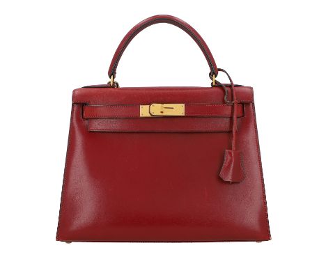 HERMÈS VINTAGE Henkeltasche "KELLY BAG 28", Koll.: 1993. Boxcalf Leder in Weinrot mit vergoldeter Hardware, Riemenverschluss 