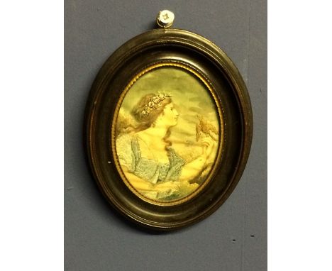 Oval miniature needlework/tapestry depicting a lady with dove 