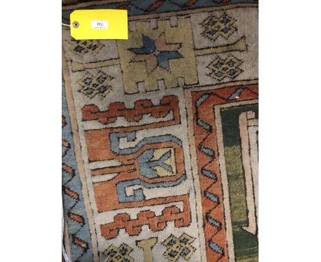 Carpet with light blue central medaillion with all over cream blue stylized borders 186 X 254 cm