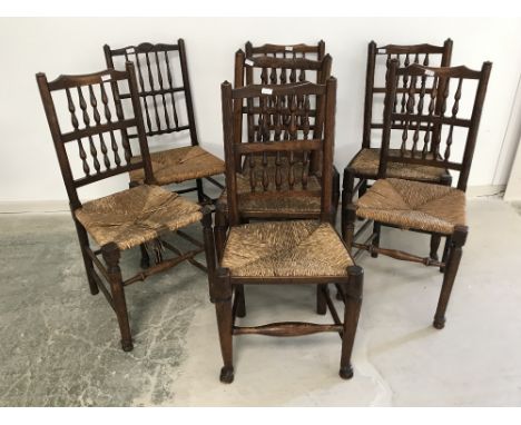 Harlequin set of 7 oak stick back, rush seat dining chairs 