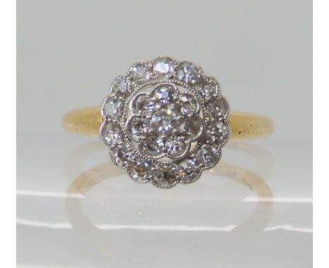 An 18ct vintage diamond cluster ring circa 1918, finger size N1/2 weight 4.3gms Condition Report: Available upon request