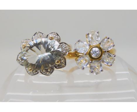 A 9ct gold green amethyst and white topaz ring size N1/2, and a 9ct gold white zircon flower ring size N1/2, weight 9.2gms, b