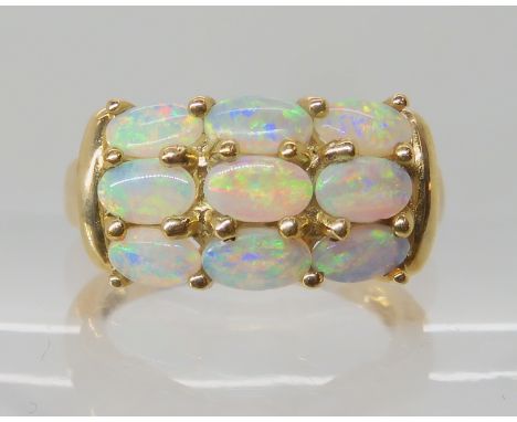 A 9ct gold jelly opal cluster ring, finger size N, weight 4.3gms With a GemsTV certificate Condition Report: Available upon r