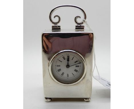 A silver cased carriage clock by William Comyns &amp; Sons, London 1901, with French movement and retailed by West&amp; Sons,