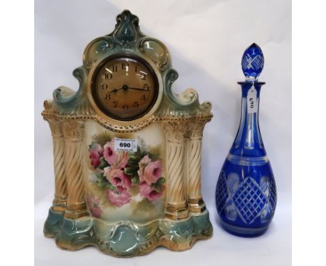 A pottery clock together with a blue flashed decanter and stopper Condition Report: Available upon request