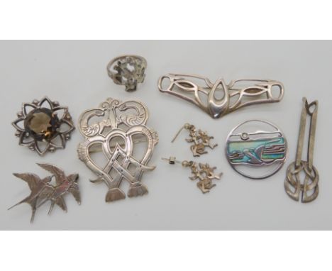A silver and enamel Pat Cheney brooch an Ola Gorie luckenbooth brooch and other designer items Condition Report: No condition