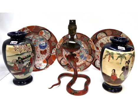 Three Kutani plates, an Indian cobra candlestick and a pair of Satsuma vases Condition Report: Available upon request