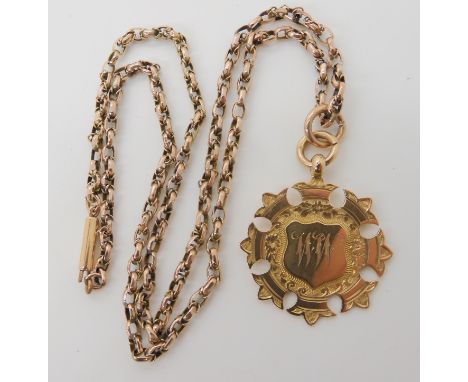 A 9ct gold medallion and vintage chain, weight 10.3gms Condition Report: Available upon request