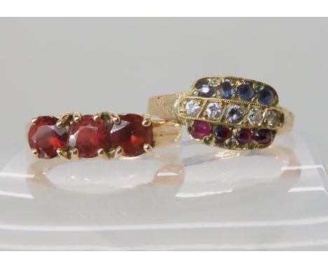 A 9ct ruby, clear gem and sapphire ring size P1/2, and a 9ct gold three red gem set ring size O1/2, weight 6.3gms Condition R