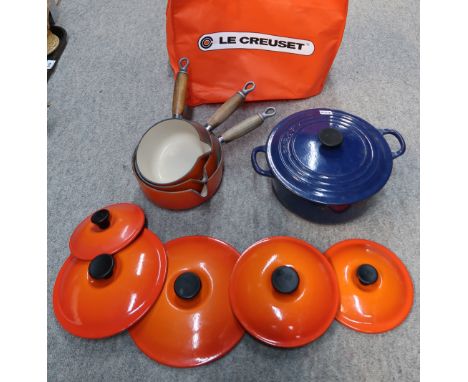 A Le Cruset blue enamel casserole pot and lid and three orange saucepans and lids Condition Report: No condition report avail