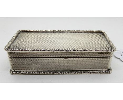 A silver snuff box, Birmingham 1962, of rectangular form with gadrooned edges and engine turned decoration, 9cm x 4.5cm, 128g