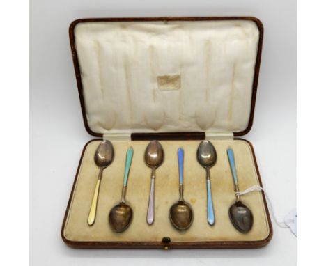 A cased set of six silver, gilt and enamel coffee spoons, Birmingham 1931 Condition Report: Available upon request