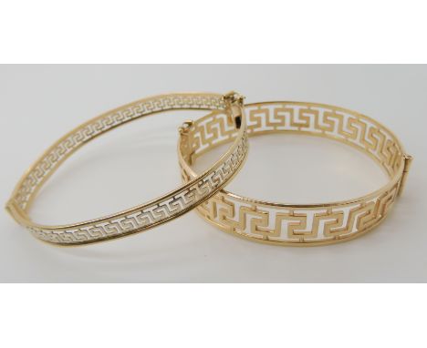 A 9ct gold Greek key pattern bangle inner dimensions 6cm x 5.3cm, together with a similar bangle combined weight 21.8gms Cond