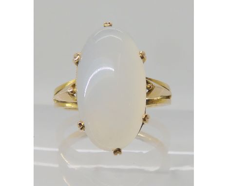 A bright yellow metal moonstone ring, moonstone approx 19mm x 10mm, ring size Q, weight 5.2gms Condition Report: Available up