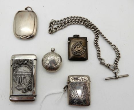 A lot comprising two silver vestas, a sovereign case (def), an Albert chain, compact and a white metal vesta (6) Condition Re