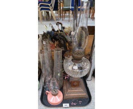 A cut glass oil lamp, a copper example and funnels Condition Report: No condition report available for this lot