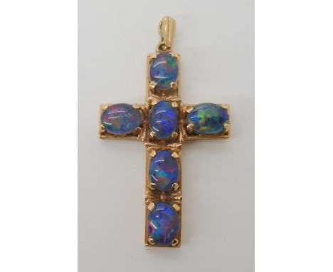A 9ct gold opal triplet set cross dimensions 4.8cm x 2.6cm, weight 6.7gms Condition Report: Available upon request
