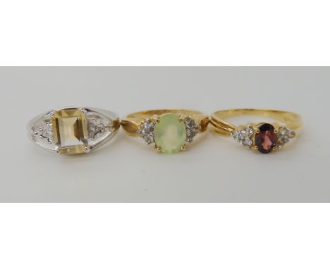 A 9ct gold citrine and white topaz ring size N1/2, a 9ct garnet and white topaz ring size O, and a 9ct prehnite and white top