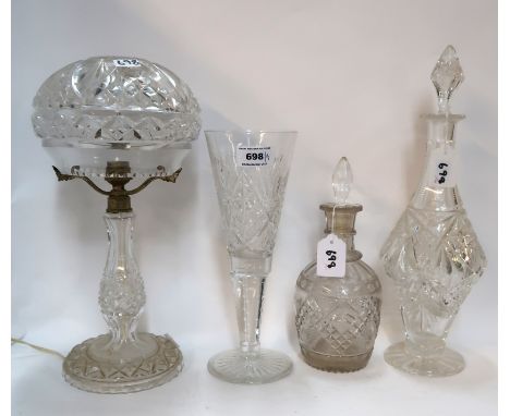 A cut crystal table lamp, two decanters and a large fluted glass Condition Report: Available upon request