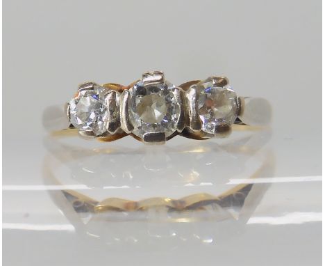 A bright yellow metal three stone diamond ring of estimated approx 0.50cts, size P1/2, weight 2.3gms Condition Report: Availa