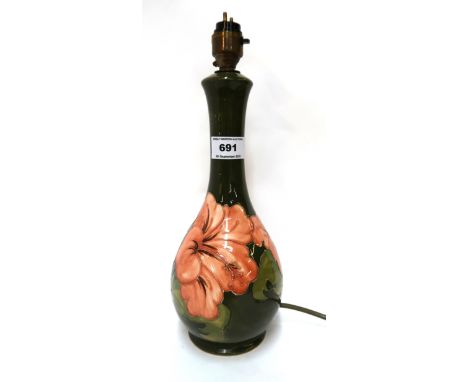 A Moorcroft Hibiscus pattern table lamp Condition Report: Available upon request