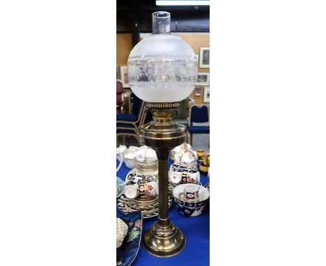 A brass oil lamp with etched shade, 71cm to top of funnel Condition Report: Available upon request