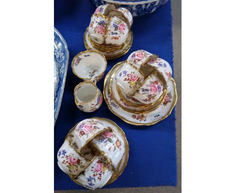 A Hammersley bone china teaset decorated with flowers comprising twelve cups, saucers, plates, cake plate, milk jug and sugar