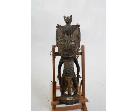 Tribal/ethnographica interest - Papua New Guinea small floor standing wooden figure of anthropomorphic form set with cowrie e