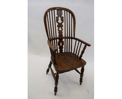 19th century elm seated Windsor chair with stick and splat back raised on turned legs with H-stretcher, 110cm high