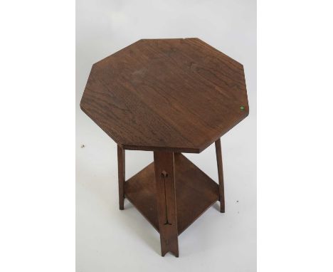 Late 19th century oak octagonal top table in the Arts &amp; Crafts style with pierced legs and a base shelf