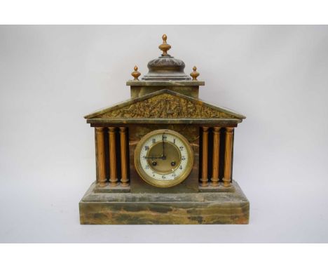 Late 19th century onyx cased mantel clock with enamelled dial with Arabic numerals to a brass twin train movement set inside 