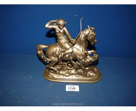 A spelter type metal figure of a girl on horse-back drawing an arrow from a quiver on her back to use her long-bow to defend 