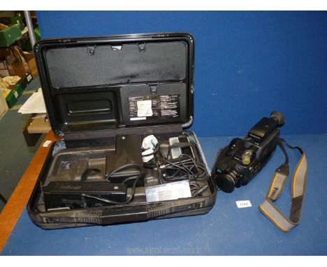 A Panasonic MC6 VHS movie camera with auto focus model no. NV-MC6B (serial number H8HE00862), in large case with battery pack