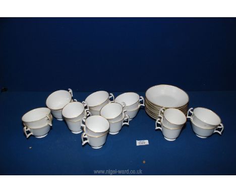 A very pretty white/gold Teaset and eight coffee cans, ten tea cups, and eight saucers.