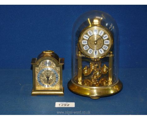 A plastic domed Anniversary Clock plus a small Swiza Swiss carriage clock.