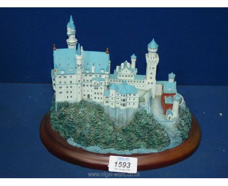 A "Lenox Great Castles of the World Neuschwanstein" model, on wooden plinth.