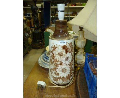 A Jersey Pottery table lamp in brown and cream with pink flowers, 18'' tall.