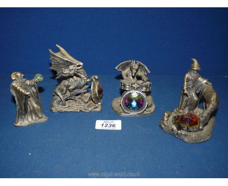 Four Myth and Magic pieces including Dragons, a horse, a cauldron of light wizard statue etc.