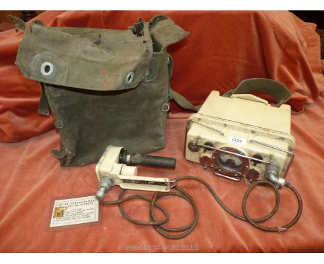 A canvas cased Contamination Meter/Indicating Unit 5CG0034 with readout in Milli-Routgens/hour and complete with probe unit a