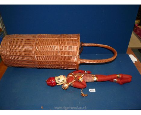 A vintage Indian deity figure rag doll and a basket weave stick stand.