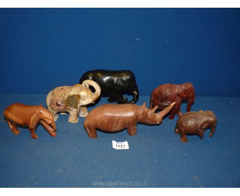 A box of wooden model elephants etc.