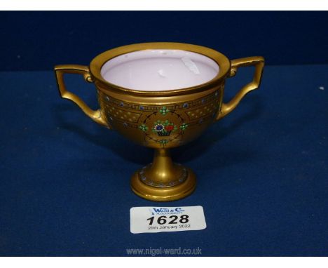 A Royal Worcester footed, two handled cup with jeweled decoration on a gilt ground, dated 1919, 3" tall.