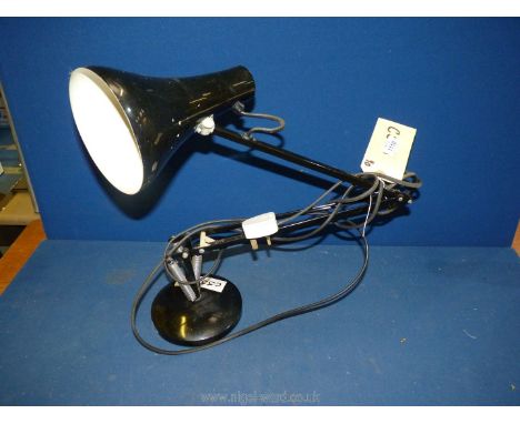 A black Angle poise lamp.
